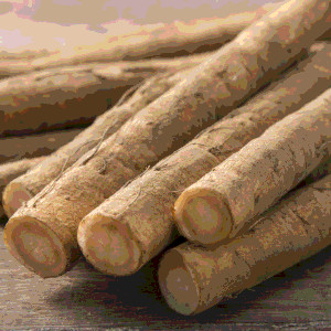 A pile of long thin brown root vegetables, like carrots but with a woody color